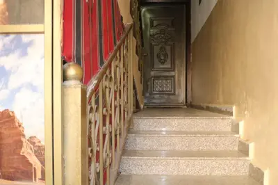 a stairway with a door in a building at Premium apartment Section A in Wadi Musa