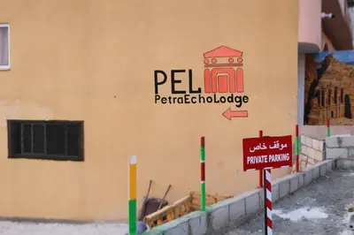 a building with a sign on the side of it at Premium apartment Section A in Wadi Musa