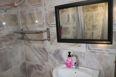 a bathroom with a sink and a mirror at Premium apartment Section A in Wadi Musa