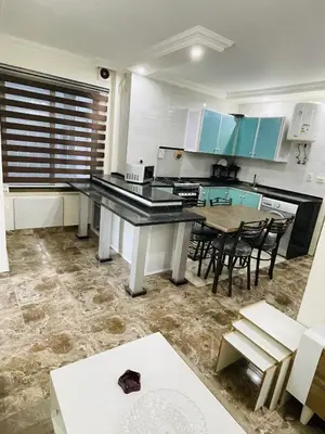 a kitchen with a table and chairs in a room at New studio in Jabal Amman and Al-Weibdeh متابعة in Amman