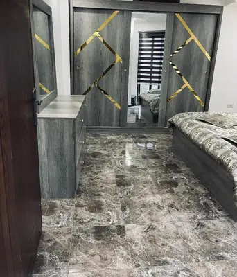 a bedroom with a bed and a mirror at New studio in Jabal Amman and Al-Weibdeh متابعة in Amman