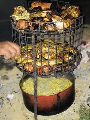 a rack of food on top of a pot at Camping Guide in Dana