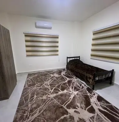 a room with a bed and a rug on the floor at Miami Luxe Apartment ماركا