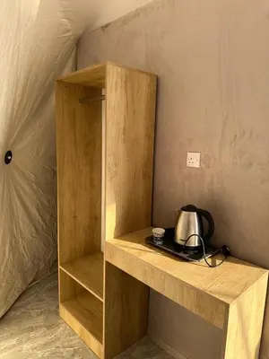 a wooden shelf with a tea kettle on it at Sana Rum Luxury Camp in Wadi Rum
