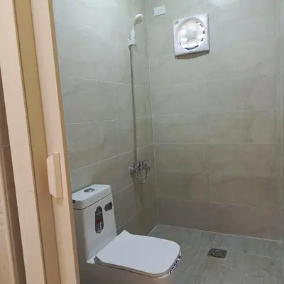 a bathroom with a shower with a toilet in it at ابو عبدالله للشقق الفندقيه in Ajloun