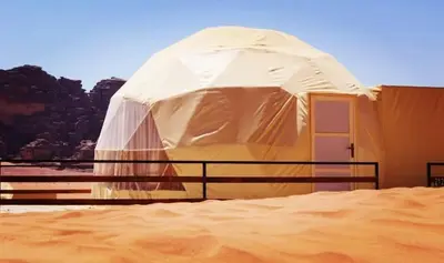 a large tent in the middle of a desert at وادي رم in Wadi Rum