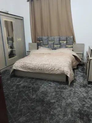 a bedroom with a large bed and a mirror at The Fog mountain in Kerak