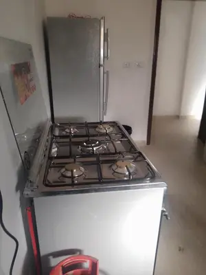 a stove top oven sitting in a kitchen at The Fog mountain in Kerak