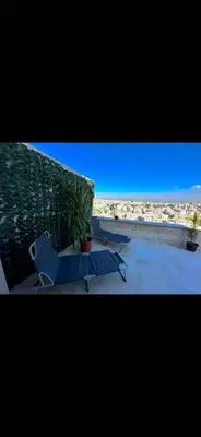 a view of a skateboard ramp and a plant at Doctor roof in Amman