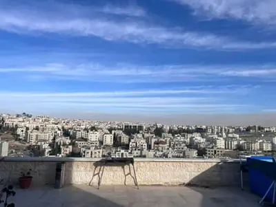 a view of a city from the roof of a building at Doctor roof in Amman
