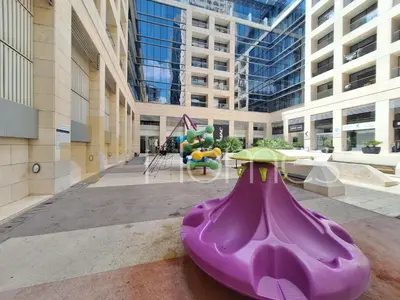 a purple slide in the middle of a building at Studio at Damac Jordan in Amman