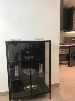 a glass shelf in a kitchen with two glasses on it at DAMAC Tower Amman boulevard برج داماك - عمان البوليفارد العبدلي in Amman
