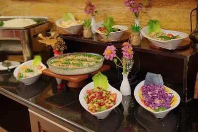 a group of bowls of food on a counter at Corner View Hotel in Wadi Musa