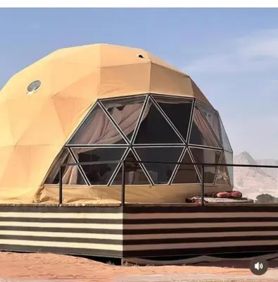 a dome shaped tent sitting in the desert at Rum Magic Bubbles in Wadi Rum