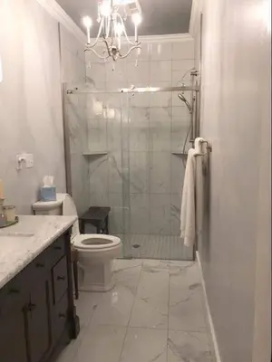 a bathroom with a shower and a toilet and a sink at Moon Red Bubbles Camp in Wadi Rum