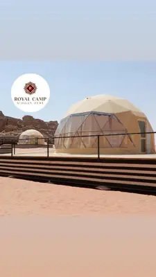 a large domed building on the side of a beach at Thirteen Luxury Camp Valley in Wadi Rum