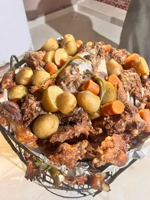a plate of food with vegetables and meat at Amira Luxury Camp in Wadi Rum