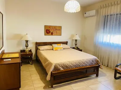 a bedroom with a bed and two lamps and a window at شقة مفروشة الدوار الخامس in Amman