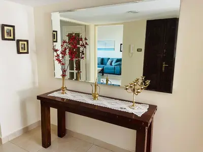 a room with a table with a mirror at شقة مفروشة الدوار الخامس in Amman