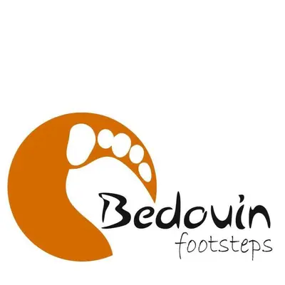 a logo for a restaurant with a hand holding a footprint at Halfway motel in An Namatah