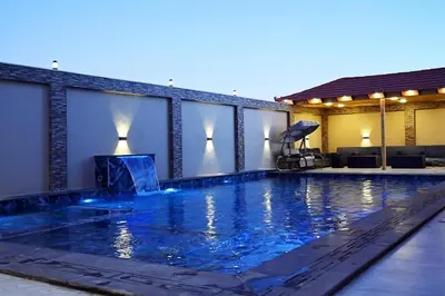 a swimming pool in the middle of a building at Sky Villa in Amman