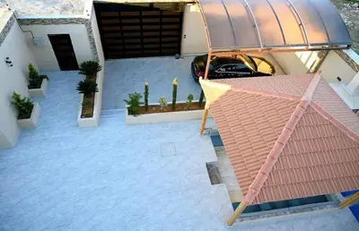 an aerial view of a house with a car parked at Sky Villa in Amman