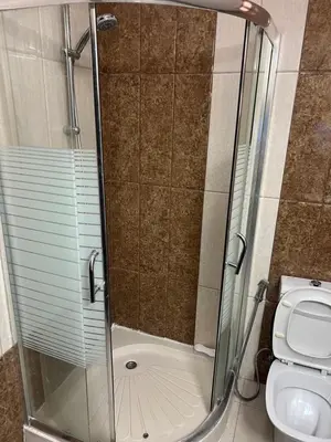 a bathroom with a shower and a toilet at كرم الضيافة in Amman