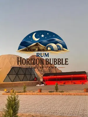 a building with a sign that reads run horizons building at RUM HORIZON BUBBlE LUXURY CAMP in Wadi Rum