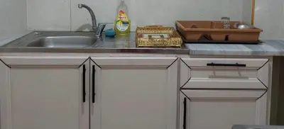 a kitchen counter top with a sink and a sink at Stone house in Amman