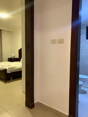 a room with a bedroom with a bed and a mirror at dabouq 3bedroom near all services JRE in Amman