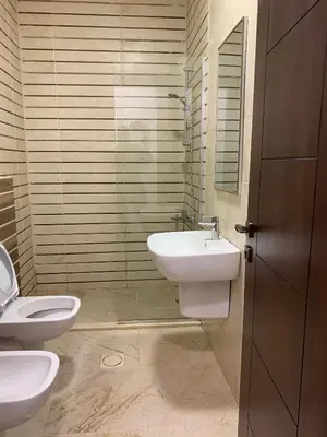 a bathroom with a sink and a toilet at Luxurious 3 Bedroom Apartment in Heart of Amman in Amman
