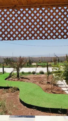 a view of a golf course with green grass at Rest Sea Chaliet & Farm