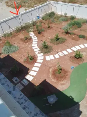 an aerial view of a garden with a walkway at Rest Sea Chaliet & Farm