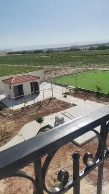 a view from a balcony of a tennis court at Rest Sea Chalet shearing Room one bed