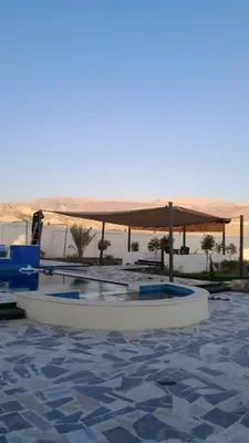 a white boat sitting in the water with a canopy at Rest Sea Chalet shearing Room one bed