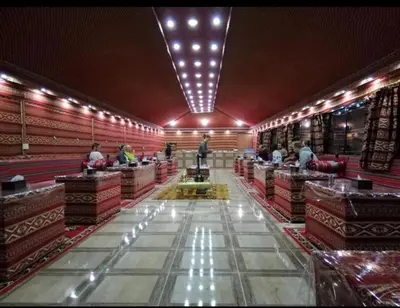 a large room with people sitting at tables in a store at Wadi Rum Bubble Dream in Wadi Rum