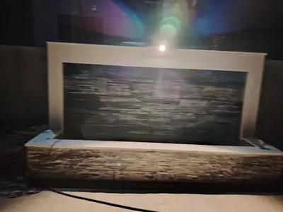 a picture frame with a light on top of it at Pine Country Farm Stay in Umm al Manābī‘
