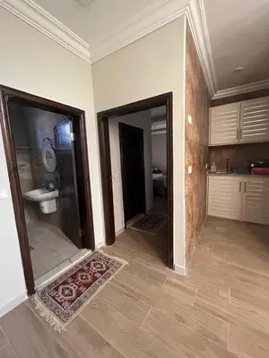 a bathroom with a shower and a sink in a room at Pine Country Farm Stay in Umm al Manābī‘