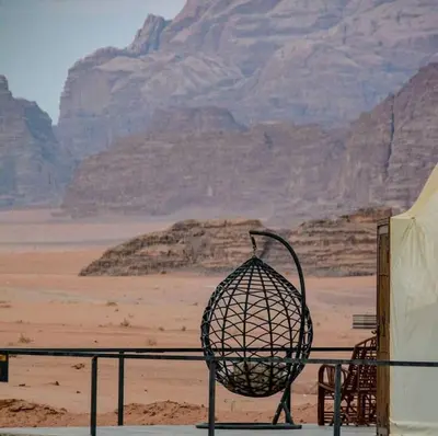a basket sitting on a railing in the desert at BUBBLE lUXURY RUM JNOPE CAMP in Wadi Rum