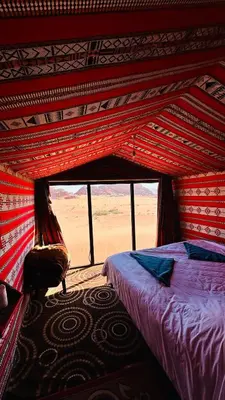 a bedroom with a bed in a tent at Desert Nights camp in Aqaba