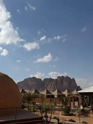 a view of a resort with mountains in the background at ELENA lUXURY CAMP in Wadi Rum