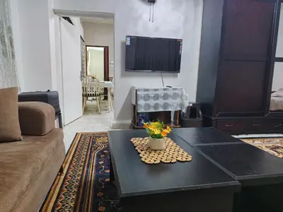 a living room with a couch and a coffee table at small house in Amman