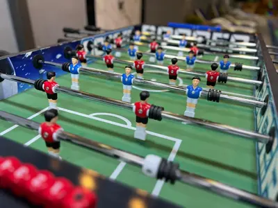 a model of a table with a group of people in a wrestling match at Bellagio Chaleht in Al Rama