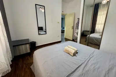a bedroom with a bed with a towel on it at Central Budget Stay in Amman