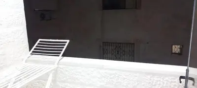 a white chair sitting on top of a building at غزو 15 in Aydūn