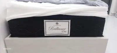 a black and white mattress sitting on top of a drawer at غزو 15 in Aydūn