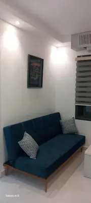 a blue couch sitting in a living room at غزو 15 in Irbid