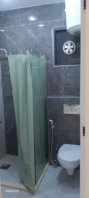 a bathroom with a shower and a toilet at غزو 15 in Irbid