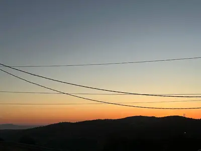 an image of a sunset with power lines at Luxury Haven villa in Jerash