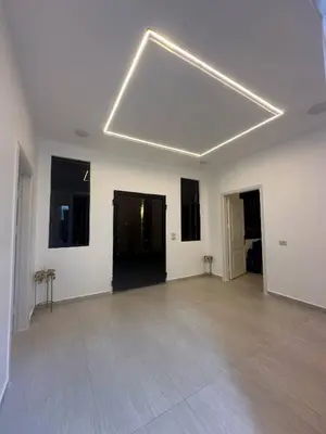 a large white room with a large ceiling at Luxury Haven villa in Jerash